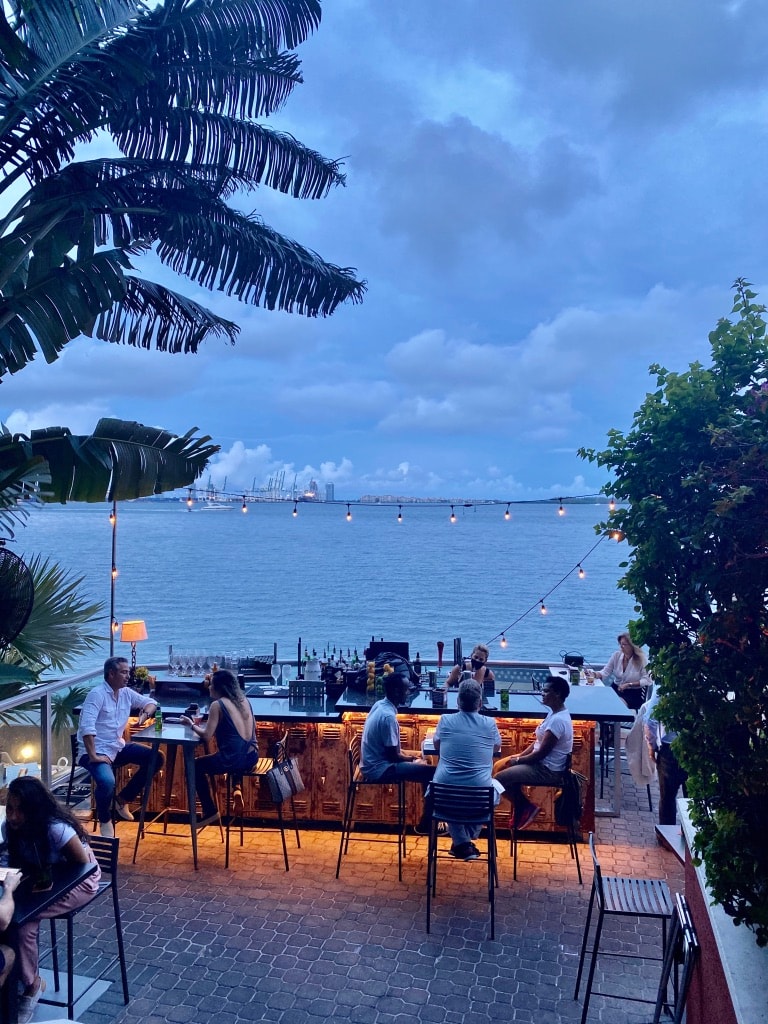 Outdoor terrace at night with Miami skyline — Crazy About You, Brickell Bay